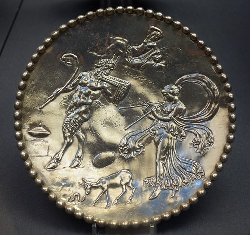 Small platter from Mildenhall with Pan and a maenad, chased in the same style as the Great Dish.