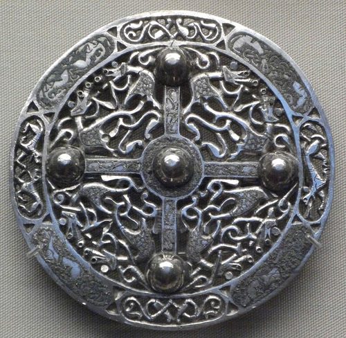 One of the paired Pentney brooches, silver openwork with niello and bossed rivets. British Museum.