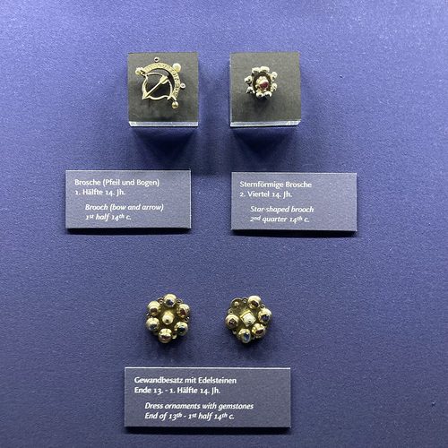 Brooches and gem-set dress ornaments from the Erfurt Treasure, Old Synagogue, Erfurt.