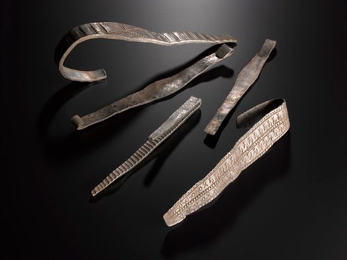 Flattened broad-band silver arm-rings from the bullion.
