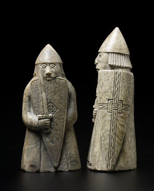 A berserker warder biting his shield, beside an ordinary warder. National Museum of Scotland.