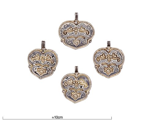 Heart-shaped pendants with gilt plant ornament. Swedish History Museum.