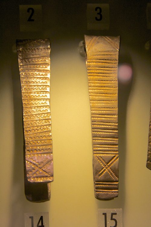 Two stamped arm-rings, one with saltire crosses.