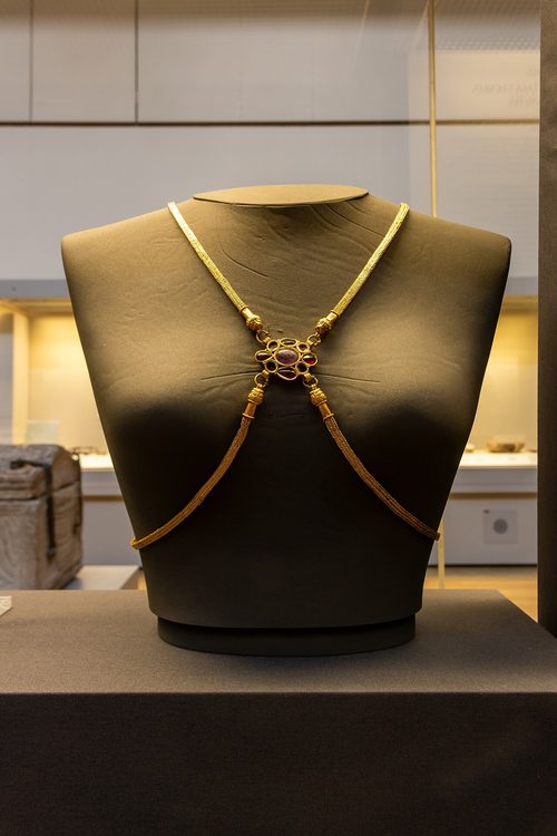The gold body-chain with its amethyst and garnet mount, British Museum.
