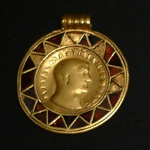 Gold medallion of Maximian (293-94) in a garnet-set frame, Kunsthistorisches Museum.