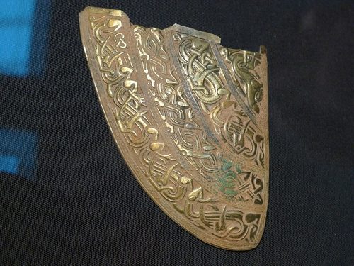 Silver-gilt cheek-piece from the Staffordshire helmet, decorated with interlace.