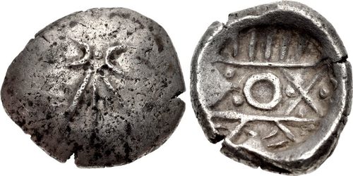 A round punch-marked coin of the Kabul valley under Persian rule, of the 'new kind' found in the hoard (not from the hoard).