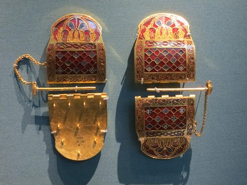 The pair of gold shoulder-clasps with garnet and millefiori inlay. British Museum.
