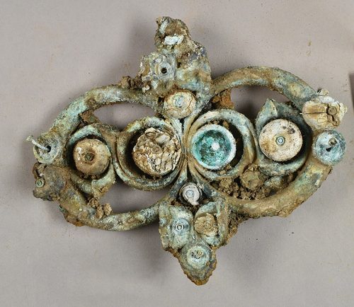 Strap junction set with coral and glass studs. Yorkshire Museum.