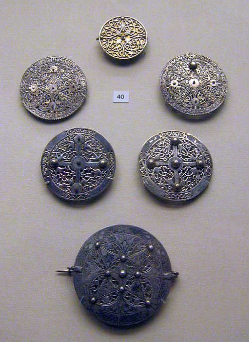 The six Anglo-Saxon openwork silver disc brooches of the Pentney hoard, Norfolk, early 9th century. British Museum.