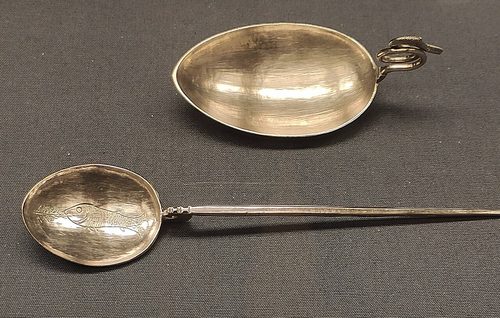 Silver spoons from the hoard, including one engraved with a fish, British Museum.