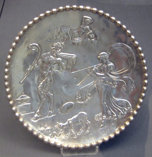 Small plate with Pan and a maenad, one of the pair inscribed for Eutherios, British Museum.
