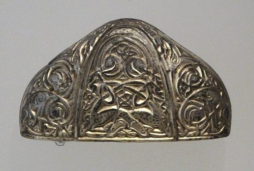 Gilded silver sword pommel with animal interlace. National Museum of Scotland.