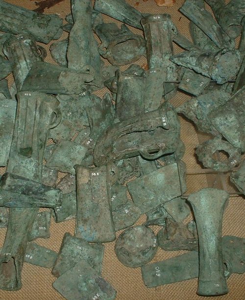 Socketed axes and other bronze castings from a Bronze Age hoard, probably gathered for recycling. Somerset County Museum, Taunton.