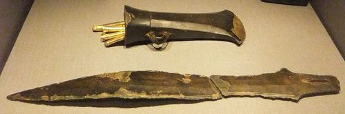 The Rossett hoard: a socketed axe, pieces of a gold bracelet and a tanged blade. Wrexham Museum.