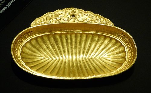One of the boat-shaped gold dishes.