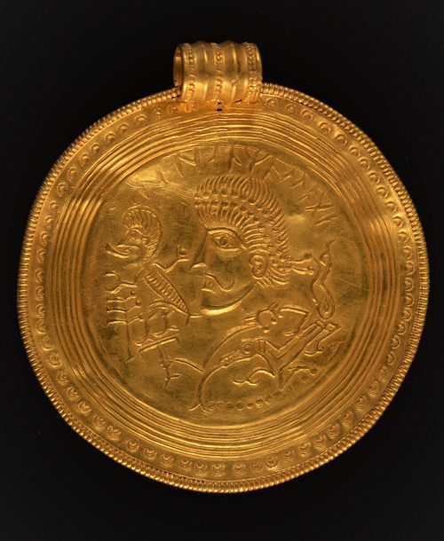 Bracteate X7: a crowned head with a horse and a small warrior figure.