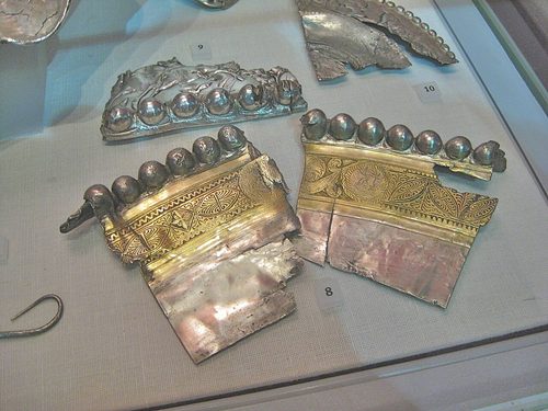 Cut fragments of decorated silver plate (hacksilver), National Museum of Scotland.