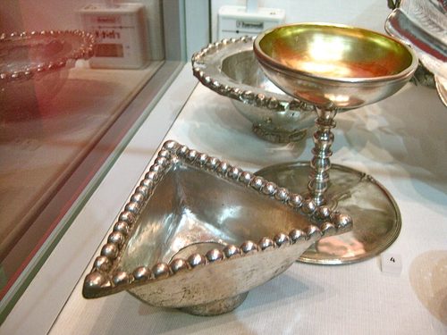 Triangular silver dish with beaded rim and pedestalled cup, National Museum of Scotland.