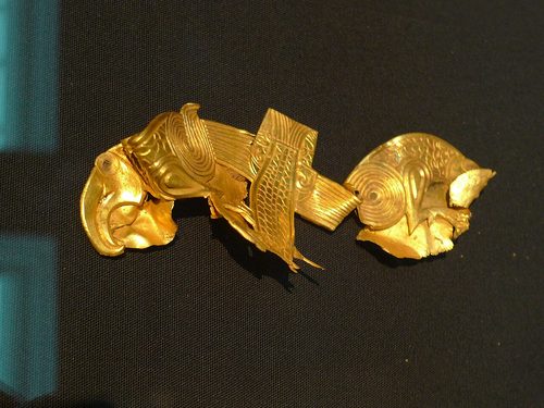 Gold mounts from the hoard in the form of stylised creatures.