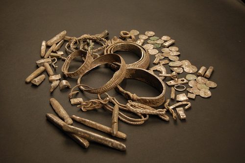 Arm-rings, ingots and coins from the hoard.