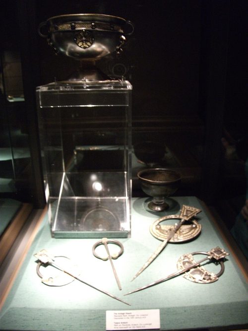 The Ardagh Hoard displayed at the National Museum of Ireland, with the chalice above the brooches.