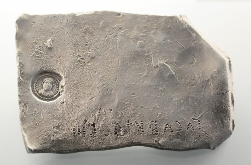 Silver ingot stamped with the portrait of Magnentius and marked with its weight.