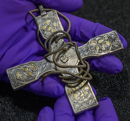 The silver pectoral cross with its wire chain.