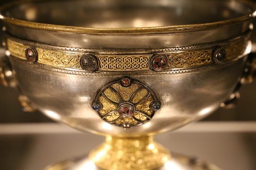 Detail of the gold filigree band and enamelled roundel on the Ardagh Chalice.