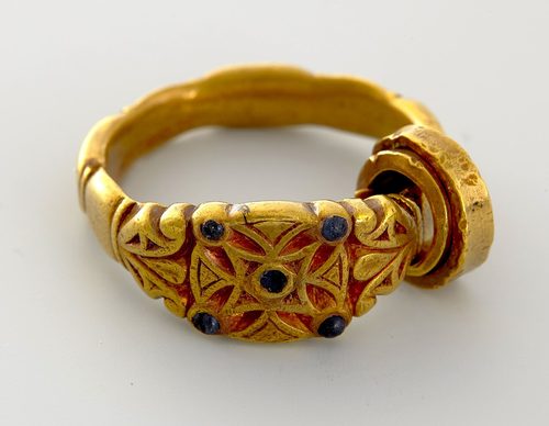 A gold finger-ring with inset stones from the hoard. Museum of Cultural History, Oslo.