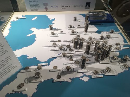 Display of the hoard with a map of the English mints that struck the coins.
