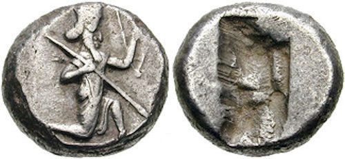 A Persian silver siglos with the running archer-king, as found in the hoard (not from the hoard).