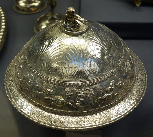 Covered flanged bowl made in Gaul, with a triton on its lid, British Museum.