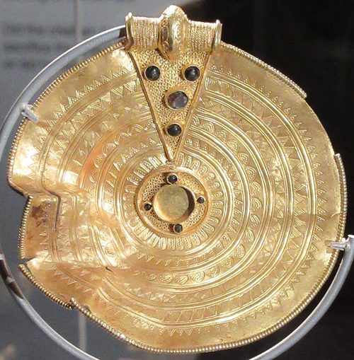 Medallion X8 with glass inlays in its loop.