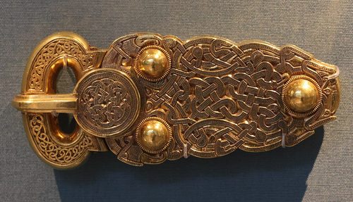 The great gold buckle, decorated with interlaced animals in niello. British Museum.
