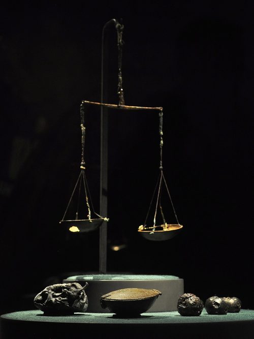 Folding scale, weights and leather pouch from boat grave 12 at Valsgärde, Sweden, 10th century, shown in the exhibition 'The Vikings Begin' in Seattle.