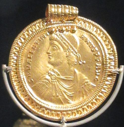 A solidus of Valentinian I framed as a pendant (X15).